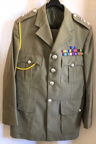 Uniform with silver buttons and coloured ribbons.