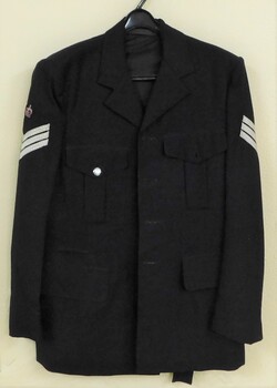 Very dark blue tunic with only one silver button.