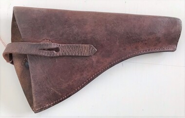 Leather pocket with strap over top.
