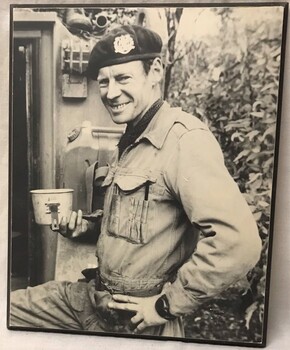 Soldier holding a tin mug