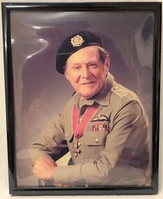 Framed coloured photograph of army officer.