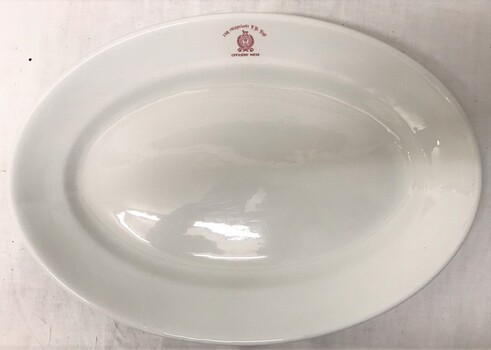 Large oval plate with monogram on rim.