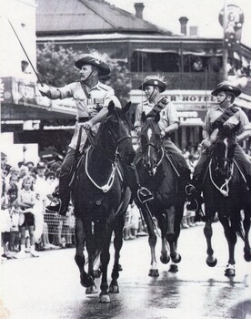 Three soldiers with swords on horses