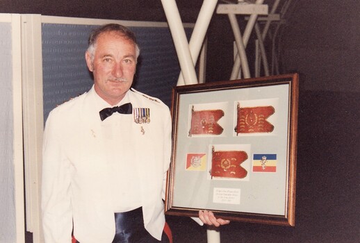 Soldier in formal uniform holding artwork