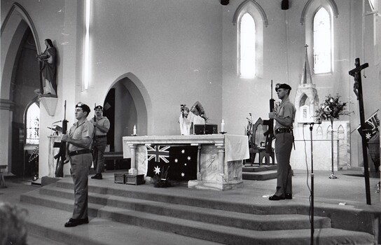 Three soldiers and a priest in a church