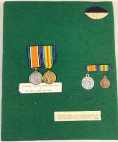 Medals with coloured ribbons and badges