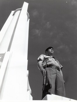 Soldier with rifle near  War  Memorial