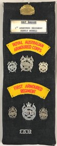 Cloth covered board with badges and signs