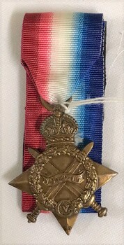 Star shaped medal with coloured ribbon attached