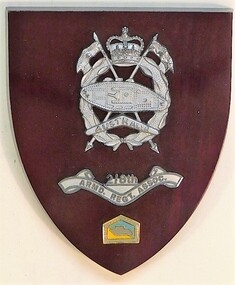 Wooden shield with raised badge