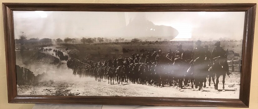 Framed photograph of many horses and soldiers