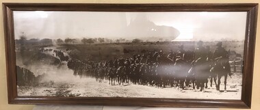 Framed photograph of many horses and soldiers