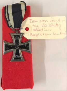 Medal with label attached to it