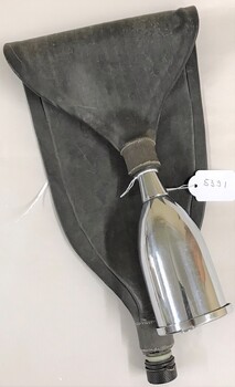 Metal funnel with bag attached to it.