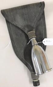 Metal funnel with bag attached to it.