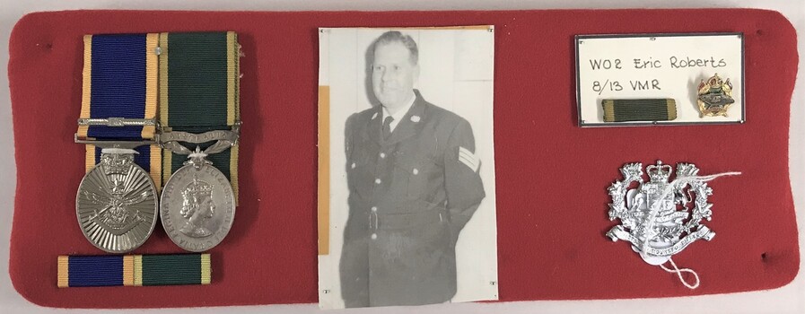 Display board with photograph, medals and badges