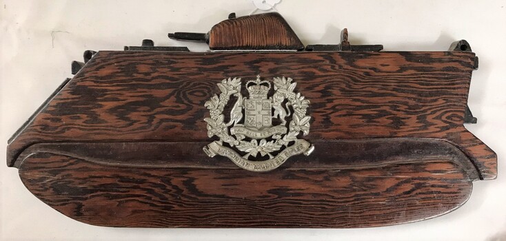 Plaque shaped like a tank plus badge