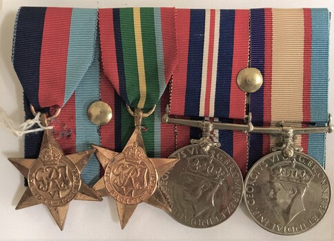 Four medals with hanging ribbons