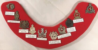 Collection of badges on a curved board