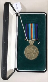 Medal with ribbon in a leather box