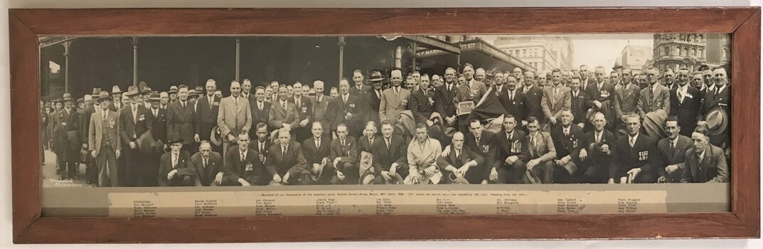 Large group of men in civilian dress.