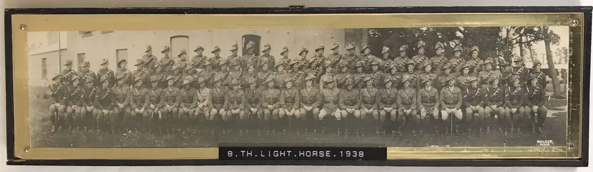 Large group of soldiers near building