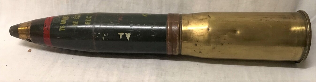 Large shell with brass base and pointed nose