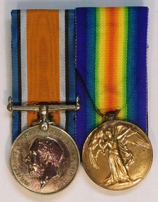 Two medals with coloured ribbons attached.