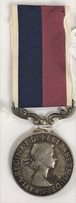 A round medal with a coloured ribbon attached
