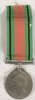 Round medal with coloured ribbon attached