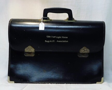 Leather brief case with title on flap