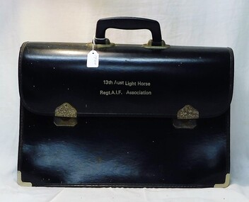 Leather brief case with title on flap