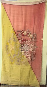 Large coloured flag with faded crest at centre