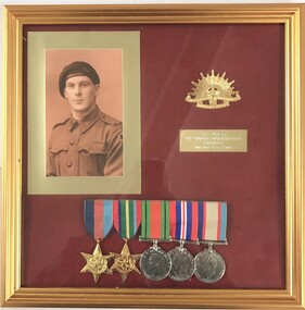 Framed display of photo and medals
