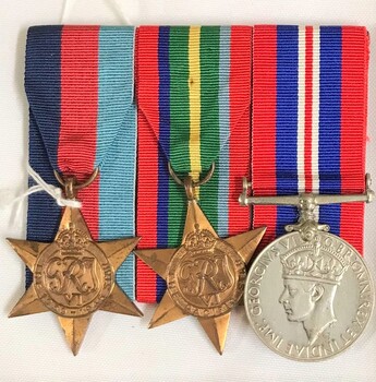 Group of three medals with coloured ribbons