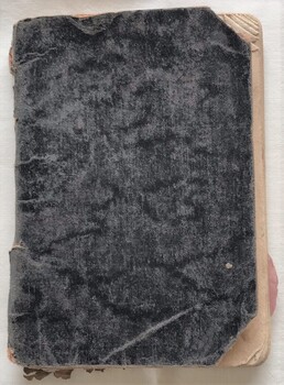 Notebook with tattered clothboard cover