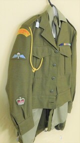 Suit of army clothing on hanger