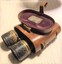 Metal binoculars  half out of case