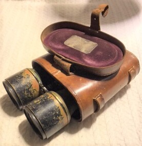 Metal binoculars  half out of case