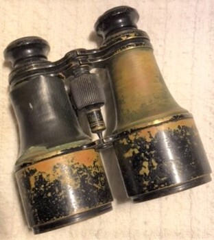 Binoculars made of metal with adjusting screw
