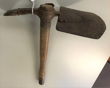 Combination of spade and pick with wooden handle