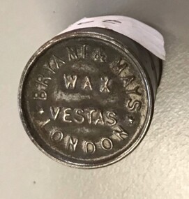 Small metal cylinder with printing on lid
