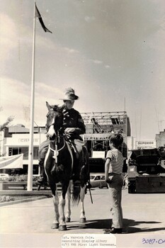 Light horseman with boy and armoured vehicle