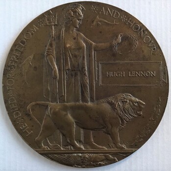 Circular medallion with goddess and lion in relief.