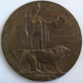 Circular medallion with goddess and lion in relief.