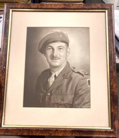 Framed portrait of soldier wearing beret