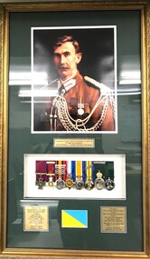 Photo of soldier with set of medals