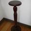 Mahogany vase stand with turned and fluted pedestal.