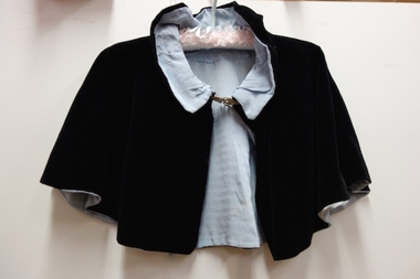 Black velvet evening cape with blue silk lining