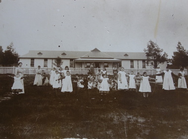 Girls in front of Ward 25, Kew Cottages